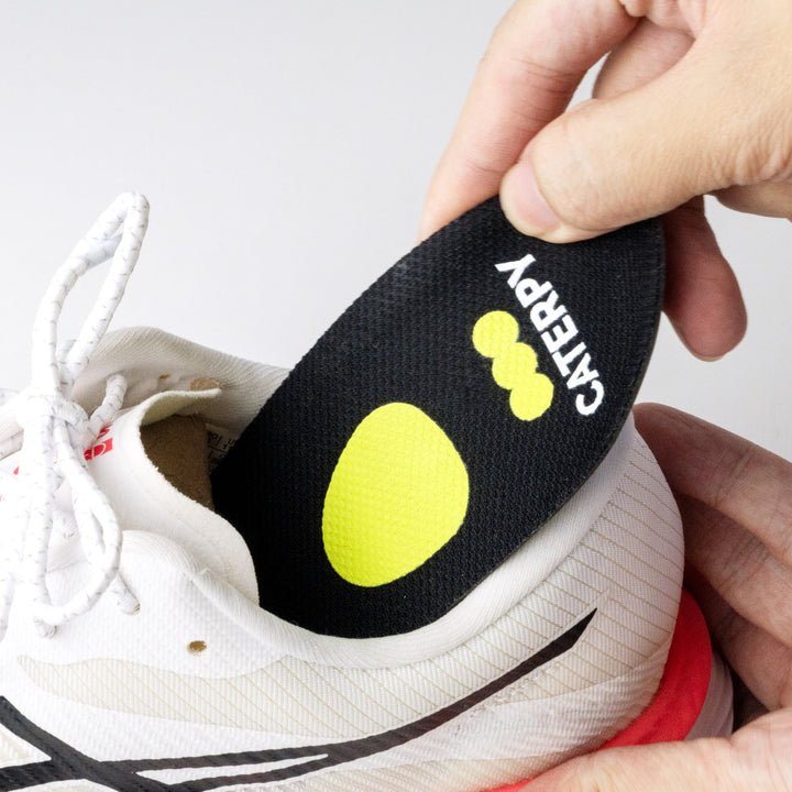 Inserting a Caterpy Cuboid Support Insole into a shoe